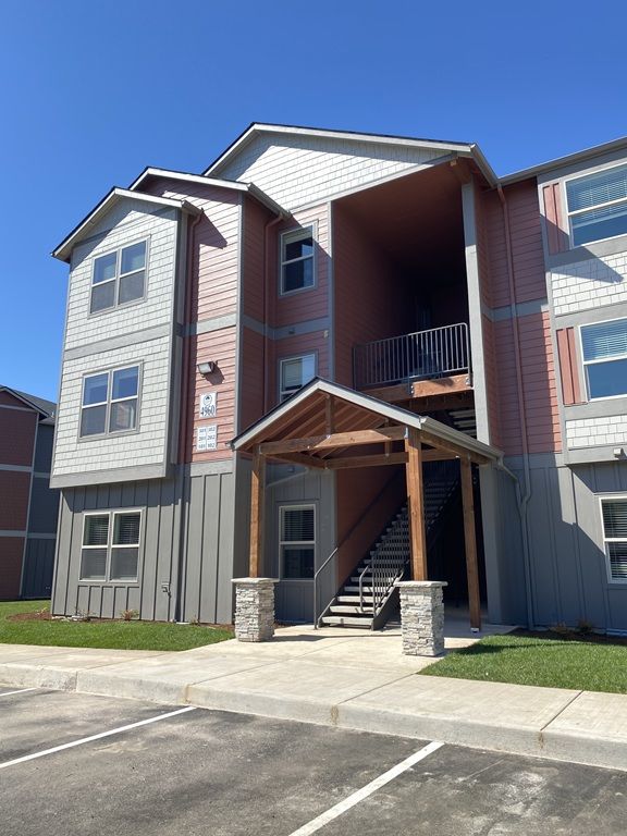 Curved handrail apartment complex front view image Crawford Crossing